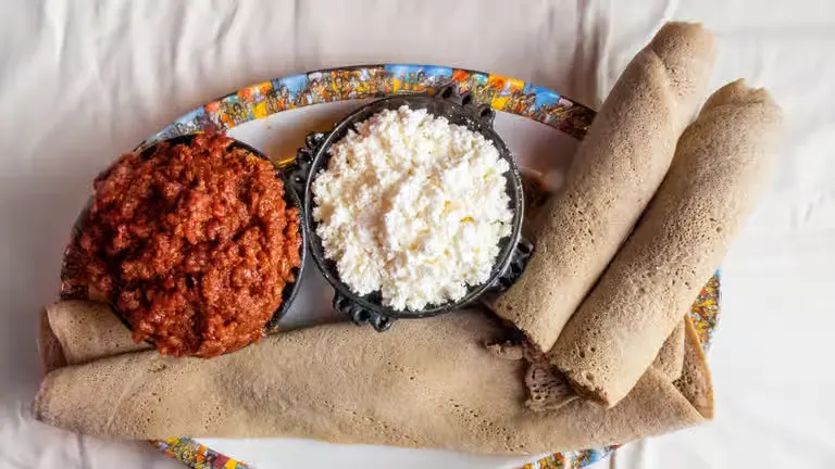 Ethiopian vegetarian combo platter with lentils and greens at Merkato Winnipeg